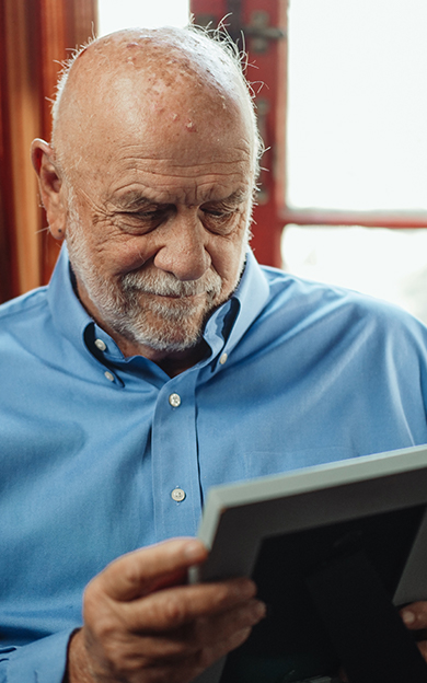 resident looking at the photo frame