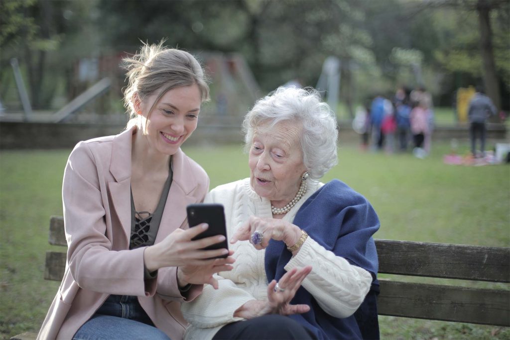 ladies sitting on a bench