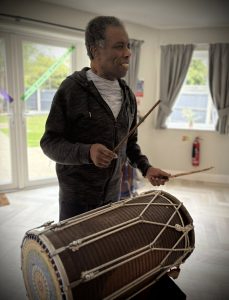 group enjoying drum performance