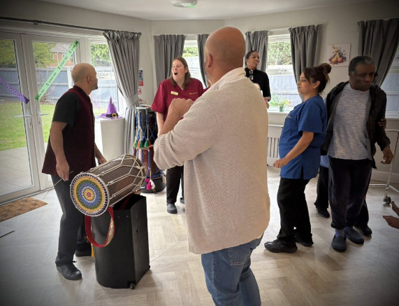 group enjoying drum performance