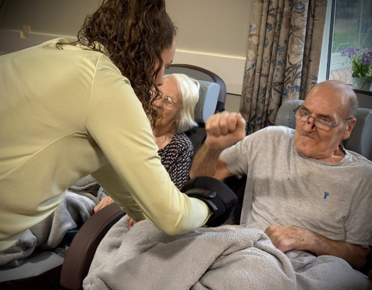 Carehome resident doing chair exercise