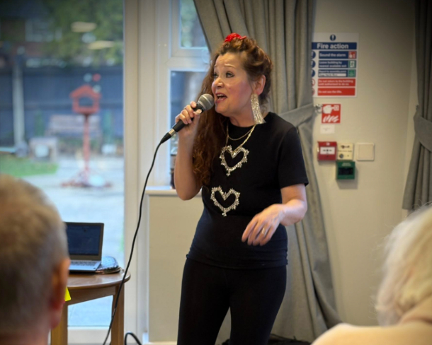 Lady singing in a care home