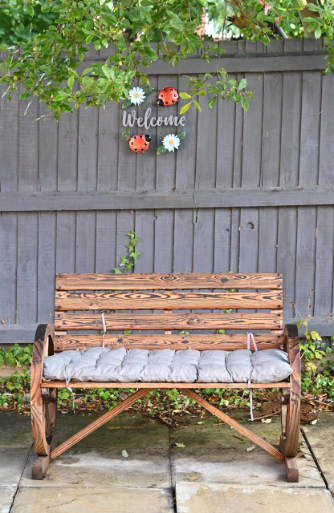 Welcome sign above a bench