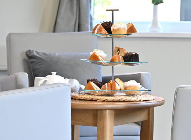 cake stand with cakes on a coffee table