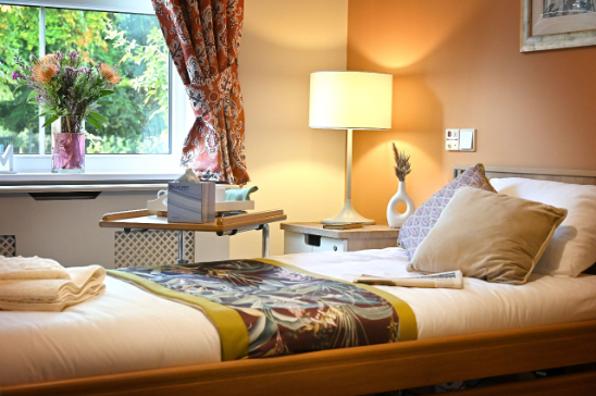 Bed with lamp on side table